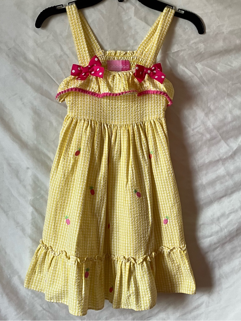 Yellow Girls' Ruffle Sundress with Pink Bow Accents size 5.